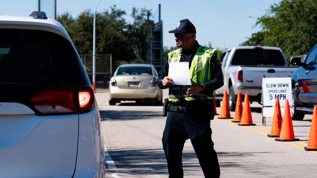 A police officer is seen redirecting traffic outside of the cancelled AstroWorld festival. Picture: Getty