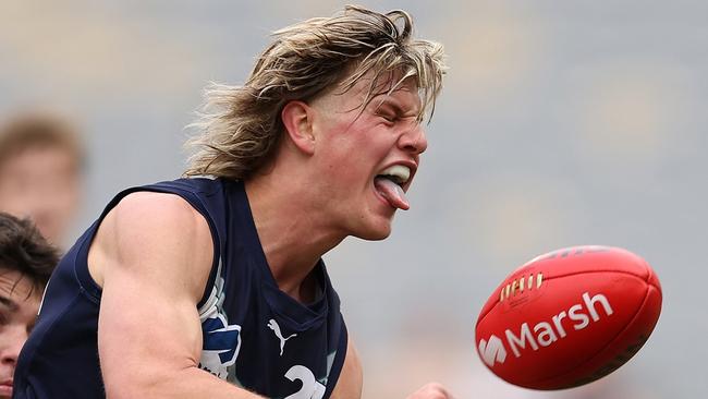 PERTH, AUSTRALIA - JUNE 23: Josh Smillie of Victoria Metro handballs during the Marsh AFL National Championships match between U18 Boys Western Australia and Victoria Metro at Optus Stadium on June 23, 2024 in Perth, Australia. (Photo by Paul Kane/AFL Photos/via Getty Images) *** BESTPIX ***