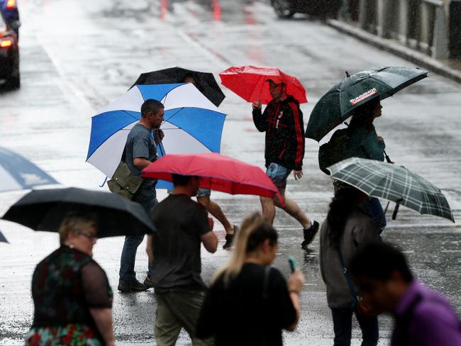 The brollies are out in Brisbane. Pic Mark Calleja