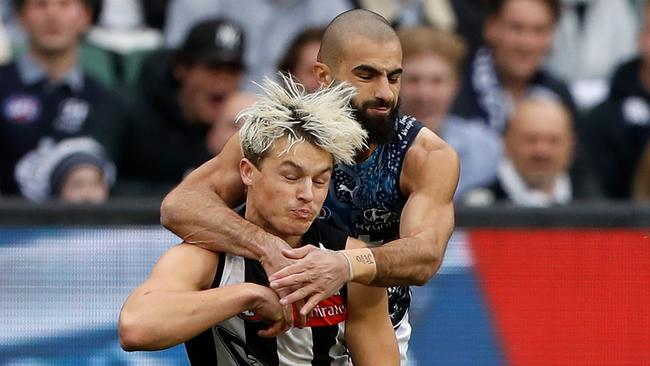 Jack Ginnivan is tackled high by Carlton’s Adam Saad in round 11.