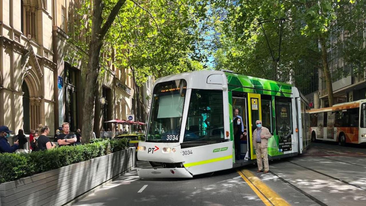 Tram derails after colliding with car on Collins Street, Melbourne ...