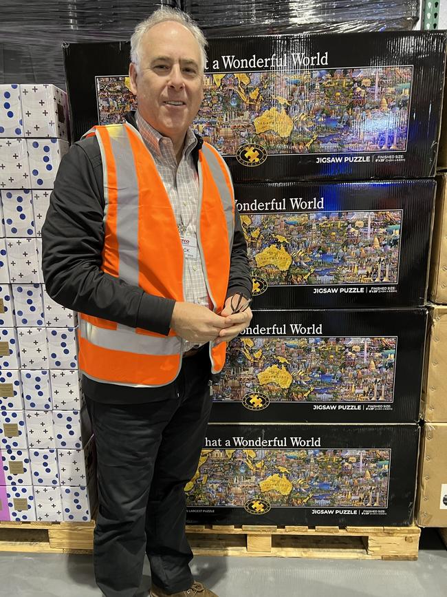 Costco Australia &amp; New Zealand Managing Director Patrick Noone with a 60,000-piece jigsaw puzzle ready for sale at the Coomera store. Picture: Keith Woods.