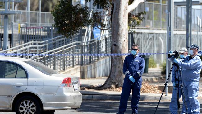 Police investigate the area around Keilor Plains railway station after Mr Lual was murdered at Regan Street, St Albans. Picture: Andrew Henshaw