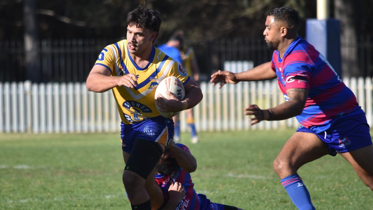 Keanu Wright-Dunrobin tries to break a tackle with Kareel Phillips looming. Picture: Sean Teuma