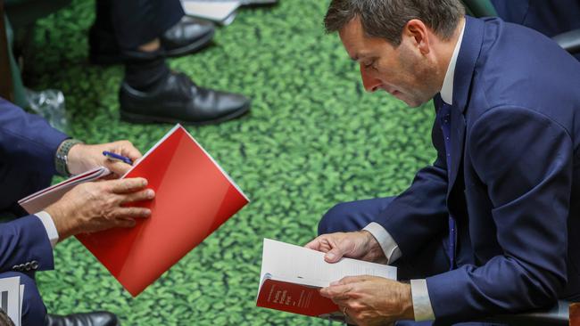 Matthew Guy reads the budget at Treasurer Tim Pallas delivers the budget in Parliament House. Picture: Ian Currie