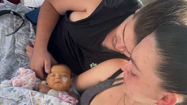 Jarred Harper and Storm Peterson holding Raevyn Harper. Picture – GoFundMe.