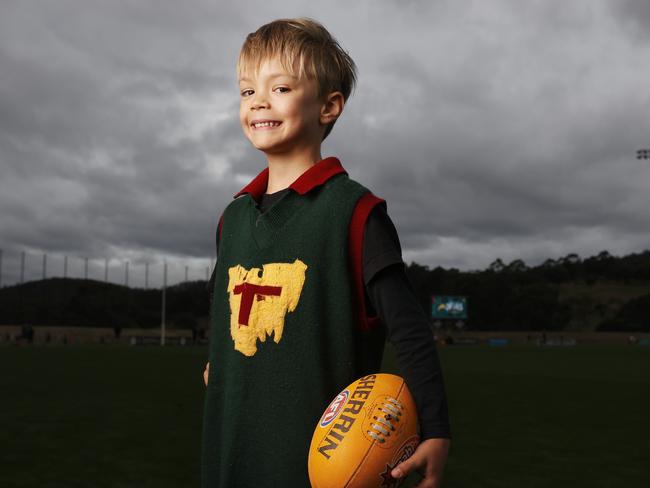 Jenson Peterson 5 wearing his grandfathers (Robert Dykes) Tasmanian state playing jumper. Tasmanian kids from across the state have been able to get in the Devils spirit at the Tasmania Football Club school holiday clinics. Picture: Nikki Davis-Jones