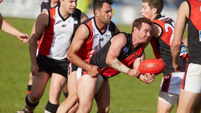 Morphett Vale coach Braden Bayly, in action when he played for the Emus, re-signed as the team’s mentor for 2020 before the win against Happy Valley on Saturday. Picture: Matt Loxton