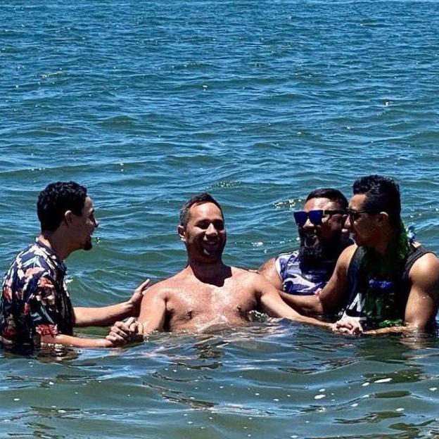 Vincent George Wiremu Hutana, who passed away after a motorcycle crash, being baptised in the company of friends and family last year. Picture: Facebook.