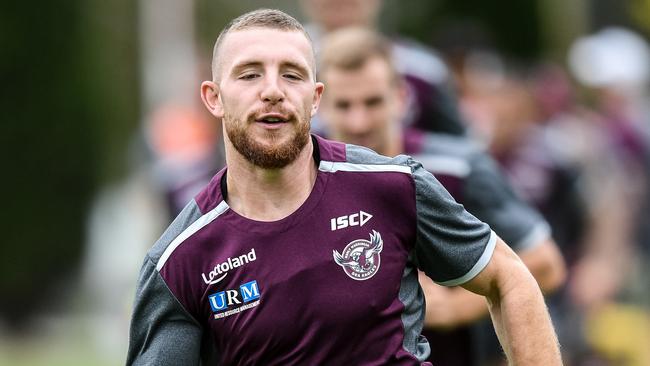 Manly-Warringah Sea Eagles player Jackson Hastings (centre) is seen warming up during a team training session in Sydney, Tuesday, April 3, 2018. (AAP Image/Brendan Esposito) NO ARCHIVING