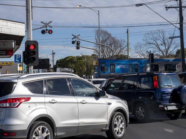 Boom gates on Glenroy Rd continue to hold up traffic. Picture: Andy Brownbill