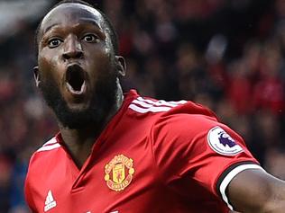 Manchester United's Belgian striker Romelu Lukaku celebrates after scoring their third goal during the English Premier League football match between Manchester United and Everton at Old Trafford in Manchester, north west England, on September 17, 2017. Manchester United won the game 4-0. / AFP PHOTO / Oli SCARFF / RESTRICTED TO EDITORIAL USE. No use with unauthorized audio, video, data, fixture lists, club/league logos or 'live' services. Online in-match use limited to 75 images, no video emulation. No use in betting, games or single club/league/player publications.  /