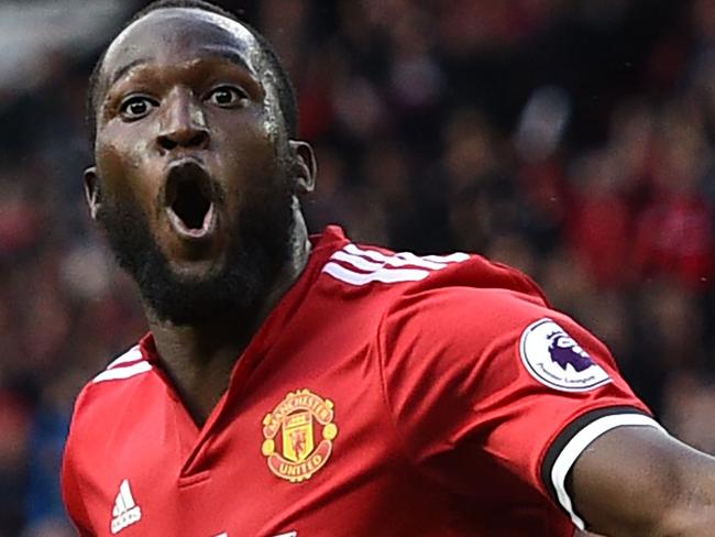 Manchester United's Belgian striker Romelu Lukaku celebrates after scoring their third goal during the English Premier League football match between Manchester United and Everton at Old Trafford in Manchester, north west England, on September 17, 2017. Manchester United won the game 4-0. / AFP PHOTO / Oli SCARFF / RESTRICTED TO EDITORIAL USE. No use with unauthorized audio, video, data, fixture lists, club/league logos or 'live' services. Online in-match use limited to 75 images, no video emulation. No use in betting, games or single club/league/player publications.  /