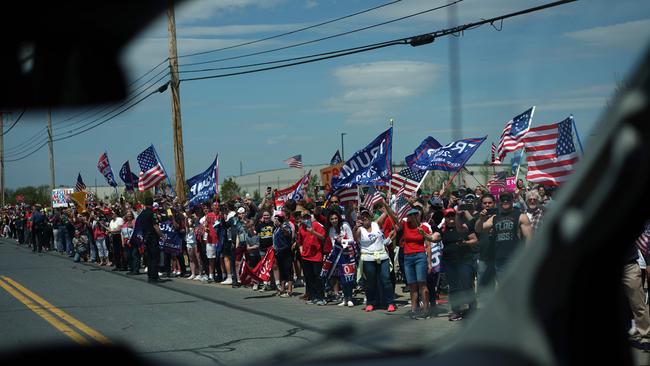 Trump supporters hold signs before US President Donald Trump visits medical supply distributor Owens and Minor Inc. in Allentown, Pennsylvania on May 14.