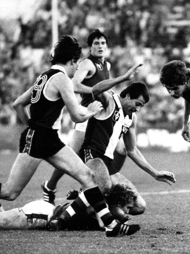 Gary Odgers straddling a Melbourne opponent when he played for St Kilda.