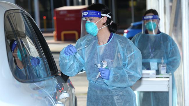 An Australian Clinical Labs team at a drive-through COVID-19 testing site in Geelong West. Picture: Picture: Alan Barber