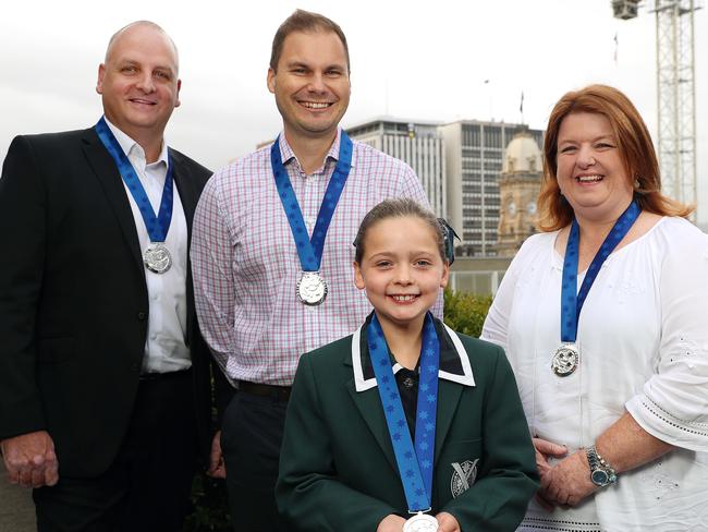 WINNERS: Harriette Rogers, 9, with Brett Partington, left, Steven Cameron, and Rachael Zaltron. <b>Picture: </b>DYLAN COKER