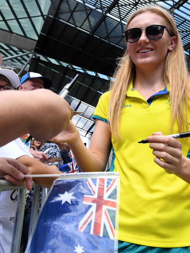 Swimmer Ariarne Titmus signs autographs. Picture: Dan Peled/AAP