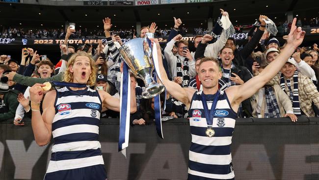 MELBOURNE, SEPTEMBER 24, 2022: 2022 AFL Grand Final between the Geelong Cats and Sydney Swans at the MCG. Sam De Koning of the Geelong Cats and Joel Selwood celebrate the win. Picture: Mark Stewart