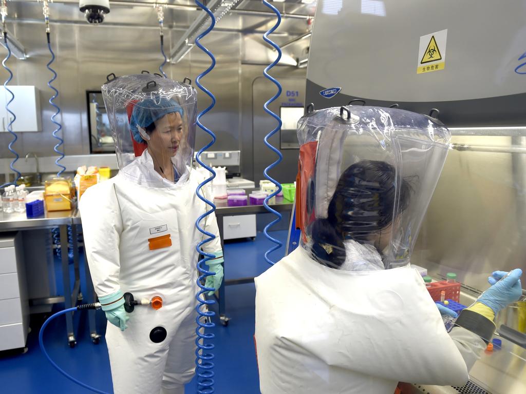 Virologist Shi Zheng-li, left, works with her colleague in the P4 lab of Wuhan Institute of Virology (WIV) in Wuhan in central China's Hubei province. Picture: Feature China/Barcroft Media via Getty Images