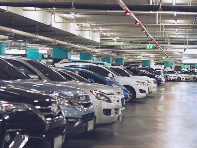 Underground carpark generic .Cars parked in the parking lot.Open space area indoors.