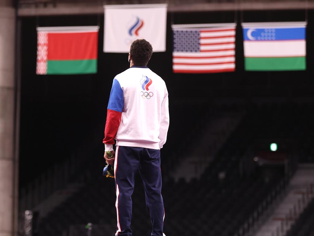 Russian athlete Zaurbek Sidakov is awarded his gold medal in the men's 74kg freestyle wrestling as the ROC flag is raised. (Photo by Valery Sharifulin\TASS via Getty Images)