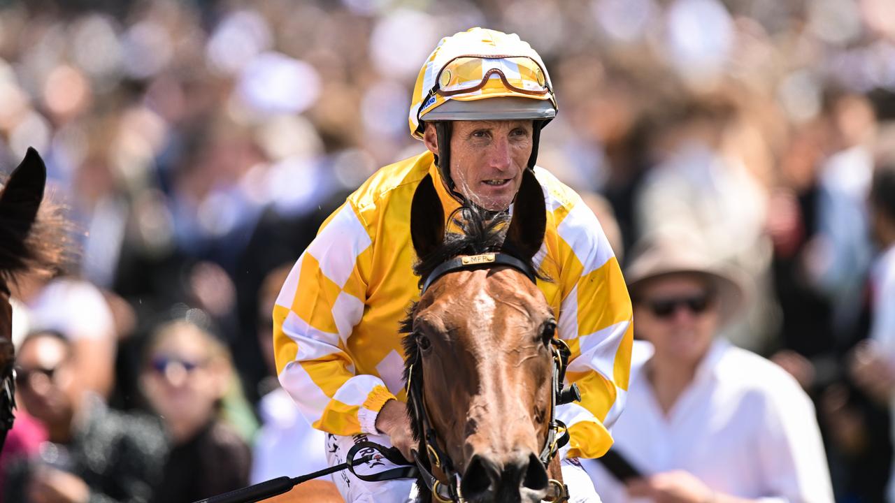 Damien Oliver returns on Queen Of The Ball. Morgan Hancock/Racing Photos via Getty Images.