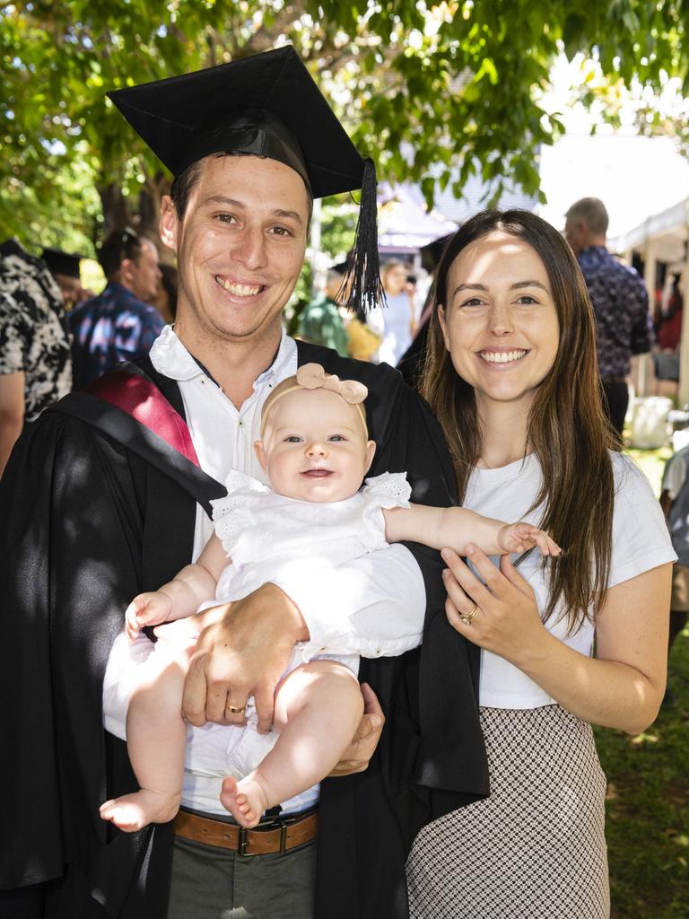 Bachelor of Spatial Science graduate Joel McMahon with daughter Rory and wife Ashley McMahon at the UniSQ graduation ceremony at Empire Theatres, Wednesday, December 14, 2022.