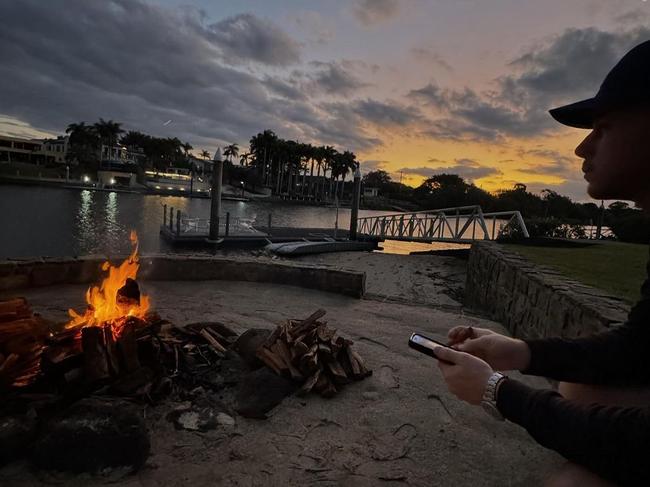 Chopra and Jonas enjoy a campfire by the water.