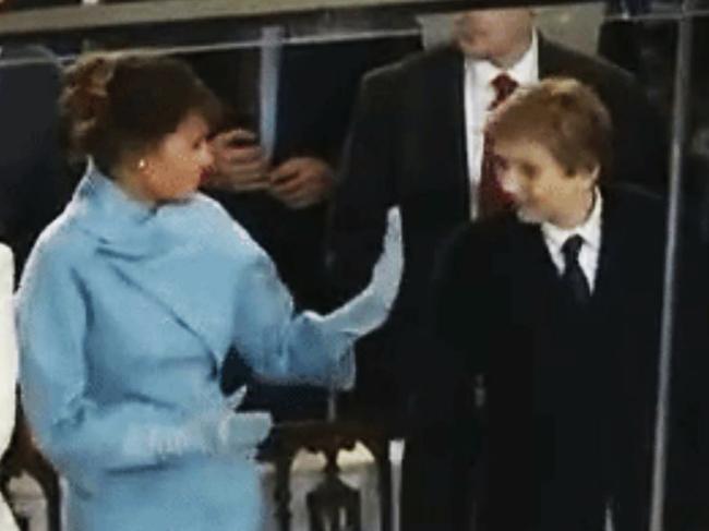 Melania Trump tries to give Barron Trump a high five. Picture: Supplied