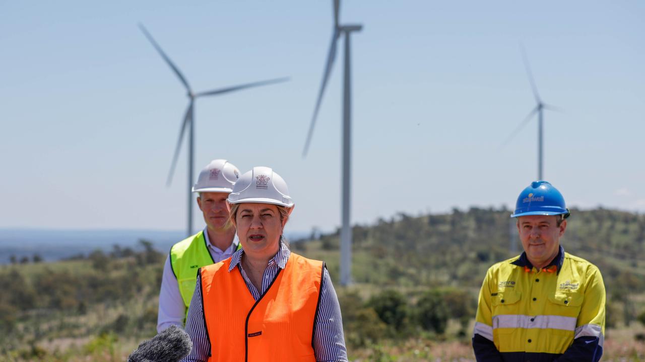 Queensland Premier Annastacia Palaszczuk speaks to the media in front of wind turbines in the South Burnett district on Monday. Picture: AAP Image/Russell Freeman