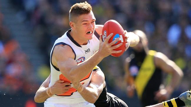 Adam Tomlinson of the Giants under pressure from during the 2019 AFL Grand Final match between the Richmond Tigers and the GWS Giants at the MCG on September 28, 2019 in Melbourne, Australia. Picture: Mark Stewart