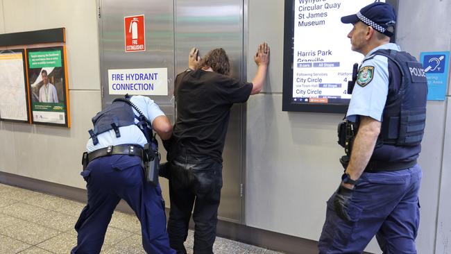 An man is searched at a train station. Picture: NSW Police