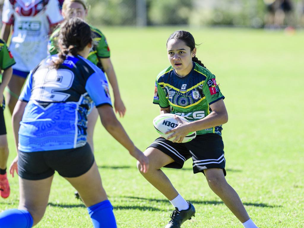 Ella-Bree King with the ball for Fairview Heights State School in the inaugural Primary Interschools Reconciliation Touch Carnival hosted by Glenvale State School, Wednesday, May 28, 2025. Picture: Kevin Farmer