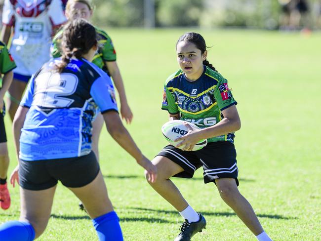 Ella-Bree King with the ball for Fairview Heights State School in the inaugural Primary Interschools Reconciliation Touch Carnival hosted by Glenvale State School, Wednesday, May 28, 2025. Picture: Kevin Farmer