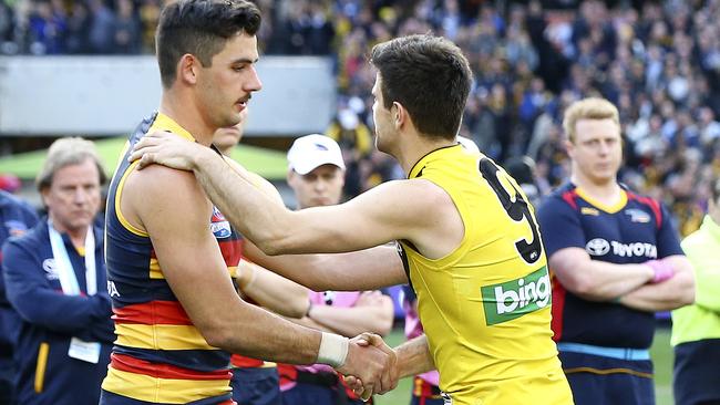 Taylor Walker and Trent Cotchin shake hands after the match. Picture: Sarah Reed