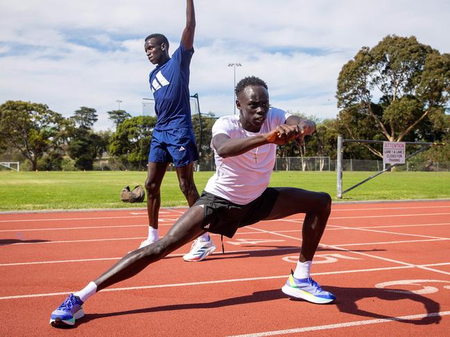 Young sprinter Gout Gout trains with Peter Bol. Picture: Mark Stewart