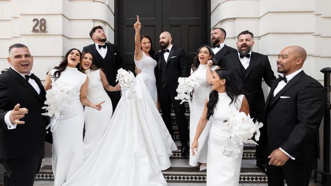 The new Mr and Mrs Milky and their bridal party on their joyful day. Picture: Emilio B Photography.