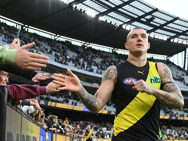 MELBOURNE, AUSTRALIA - MAY 07: Dustin Martin of the Tigers high fives fans after winning the round eight AFL match between the Richmond Tigers and the Collingwood Magpies at Melbourne Cricket Ground on May 07, 2022 in Melbourne, Australia. (Photo by Quinn Rooney/Getty Images)