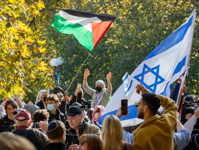 Jewish Israel supporters gather in a park near Melbourne University then walk into the university and face off with Pro Palestine protesters. Picture: Jason Edwards