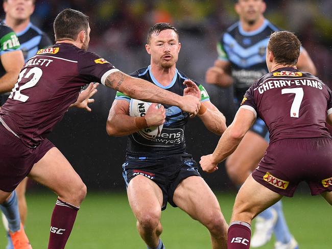 Damien Cook of the Blues is tackled by Matt Gillett (left) and Daly Cherry-Evans of the Maroons during Game 2 of the 2019 State of Origin series between the Queensland Maroons and the New South Wales Blues at Optus Stadium in Perth, Sunday, June 23, 2019. (AAP Image/Dan Himbrechts) NO ARCHIVING, EDITORIAL USE ONLY