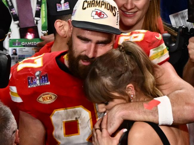 (FILES) US singer-songwriter Taylor Swift and Kansas City Chiefs' tight end #87 Travis Kelce embrace after the Chiefs won Super Bowl LVIII against the San Francisco 49ers at Allegiant Stadium in Las Vegas, Nevada, February 11, 2024. Kelce is helping survivors of the shooting that marred the Kansas City Chiefs' Super Bowl victory parade, after his world-famous girlfriend Swift did the same, NBC news reported on February 17, 2024. The shooting on February 14 left one woman dead and 22 people injured â including two girls in the Reyes family. Kelce's Eighty-Seven Running foundation made two $50,000 donations to a GoFundMe raising money to support the Reyes family, a Kelce representative confirmed to NBC. (Photo by Patrick T. Fallon / AFP)