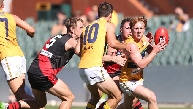 Angus Poole wins the ball during West Adelaide’s Anzac Day clash with the Eagles at Adelaide Oval. Photo: Stephen Laffer.