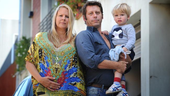 Jaime Steven and Faith Campbell with their 2yo son Harper outside their property of 3.5 years in Mayfield St Abbotsford. The area has been zoned industrial and Yarra Council is considering evicting them. Picture: Andrew Henshaw