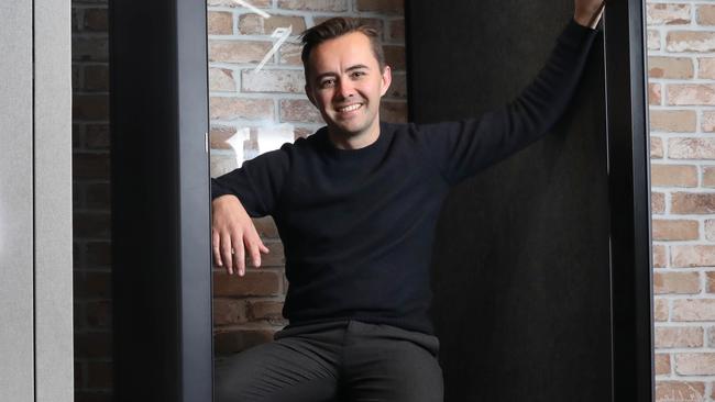Tyson Gundersen inside a Bureau Booth at the MilkBar offices on Featherstone Place in the Adelaide CBD. Picture: Dean Martin