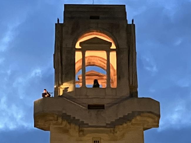 Anzac Day Dawn Service Villers-Bretonneux, bagpiper in tower of the Australian National Memorial. Picture: Brad Crouch