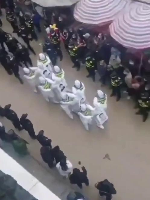 A group of alleged Chinese lockdown rule breakers were paraded through the streets of Jingxi, Guangxi Province, China. Picture: Reuters