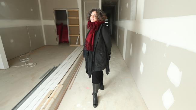 Nicole Ferguson inside her Mt Barker townhouse which is among dozens of properties left unfinished following the collapse of Coast to Coast Homes. Picture: Tait Schmaal