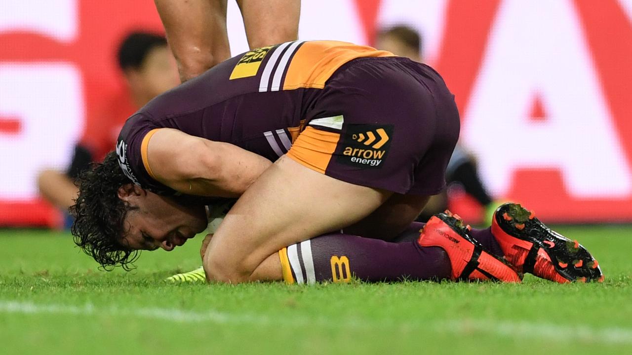 James Roberts goes down injured for the Broncos.