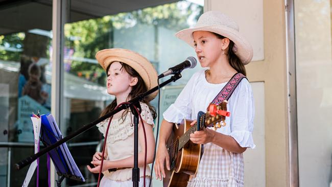 Ellie (left) and Tia Hannah busking on Peel Street in Tamworth this week. Picture: Antony Hands